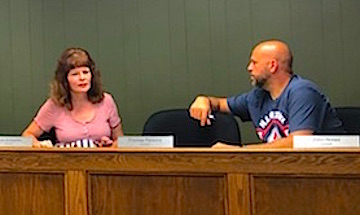 Council members Lisa Schaeffer and John Nolan were interested in hearing about the school safety program the city helps sponsors at last night's meeting.